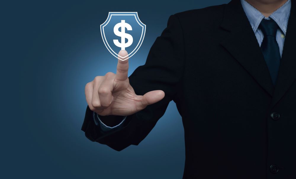 Businessman pressing dollar with shield flat icon over gradient light blue background