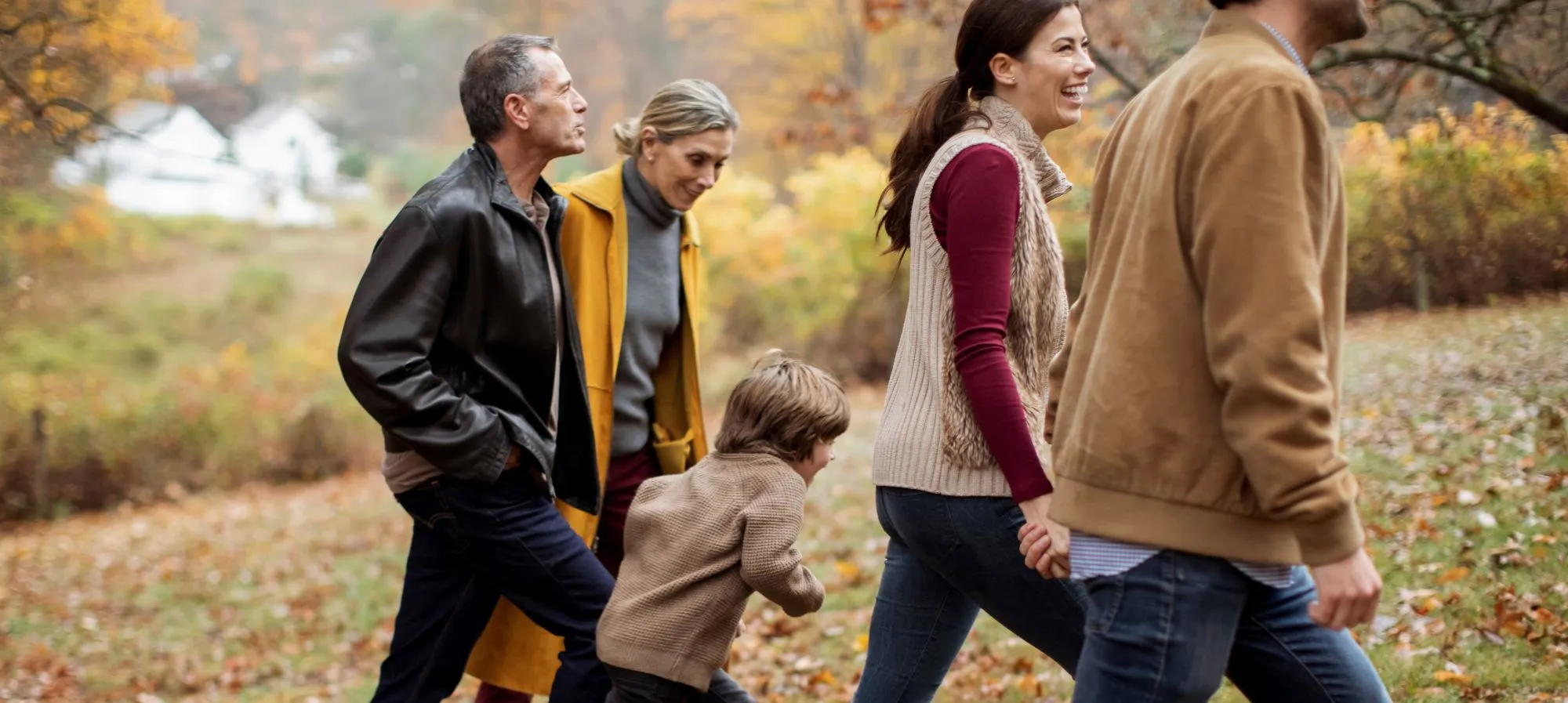 Multigenerational family strolling at a park